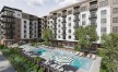 a large building with a pool in front of it