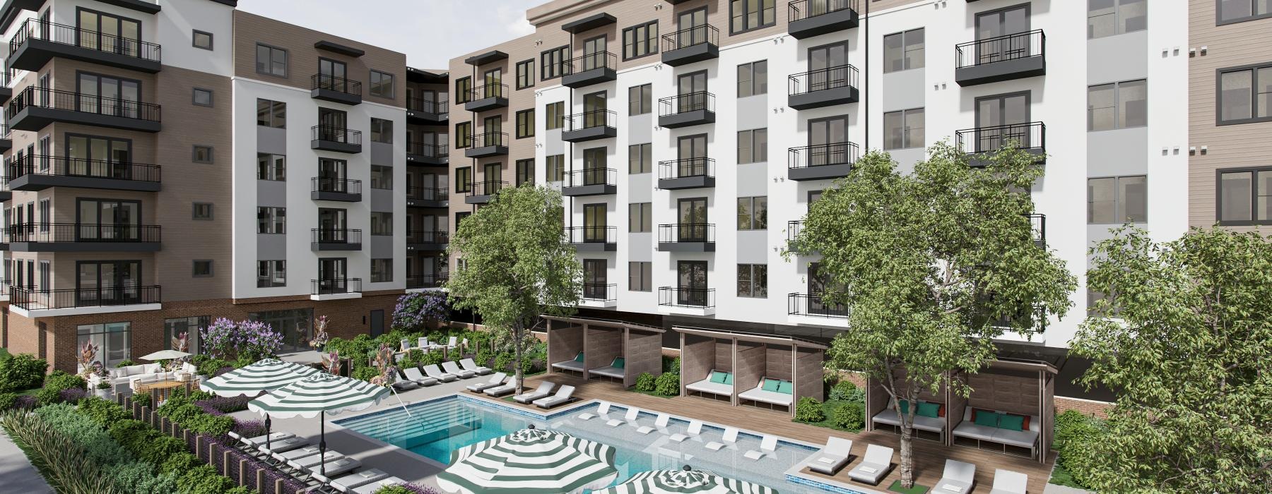 a large building with a pool in front of it