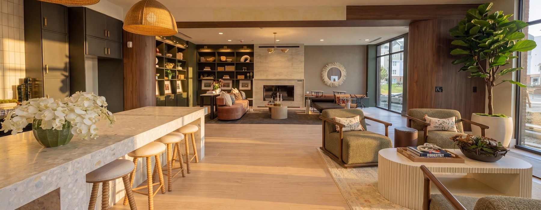 a clubroom with tables, chairs and a plant