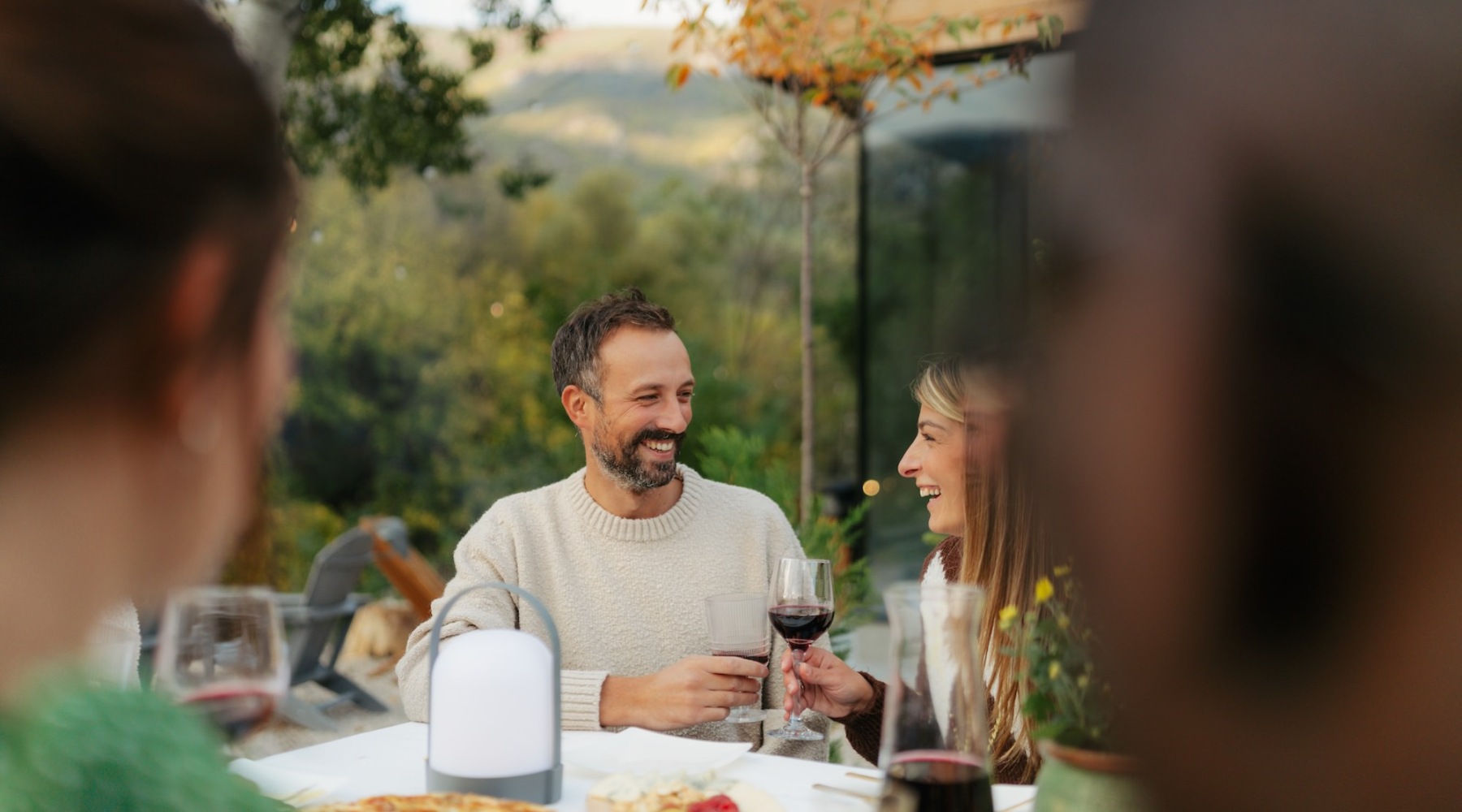 a couple with drinks at dusk