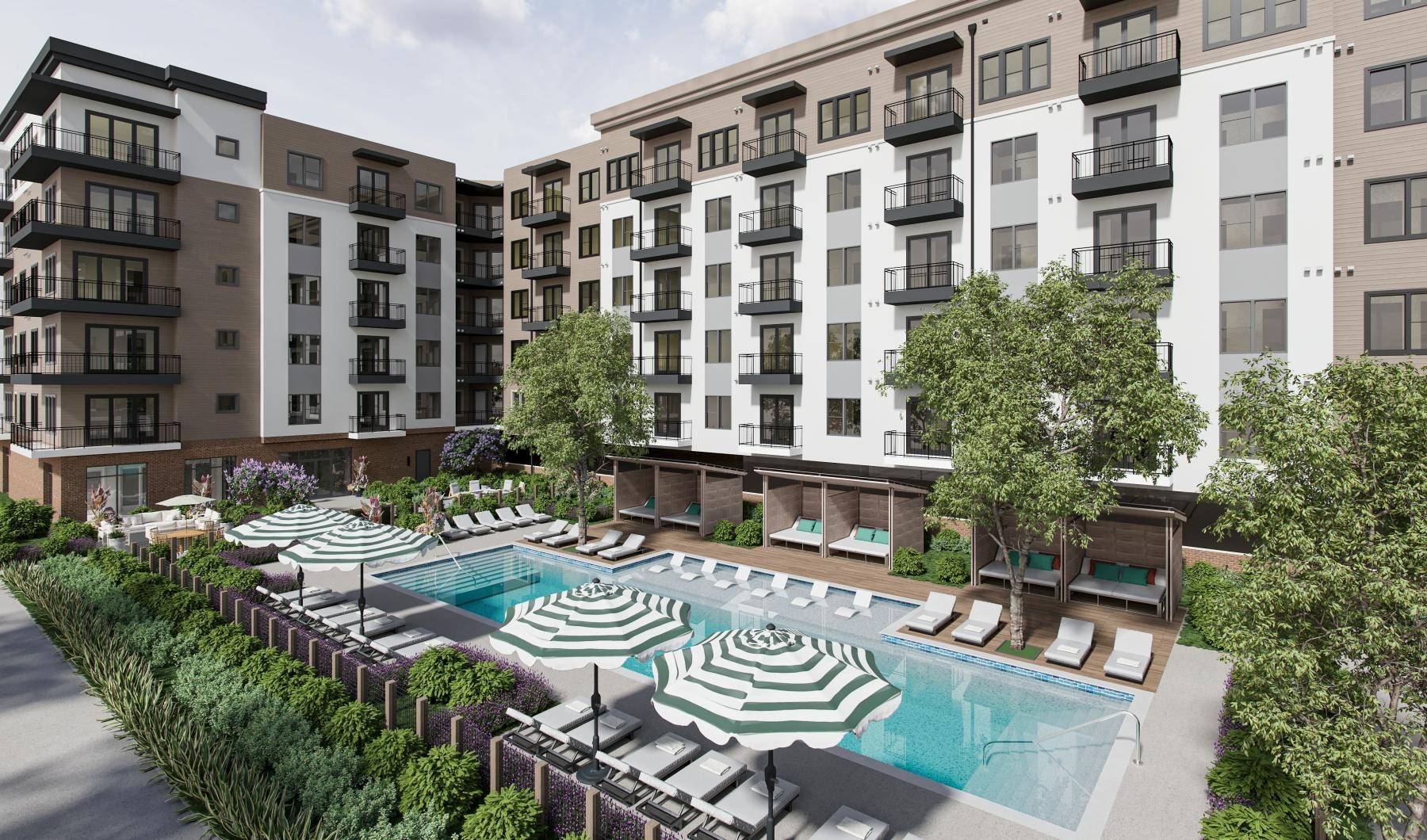 a large building with a pool in front of it