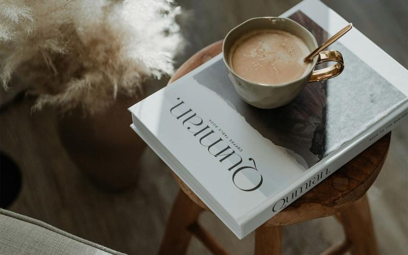 a cup of coffee on a book